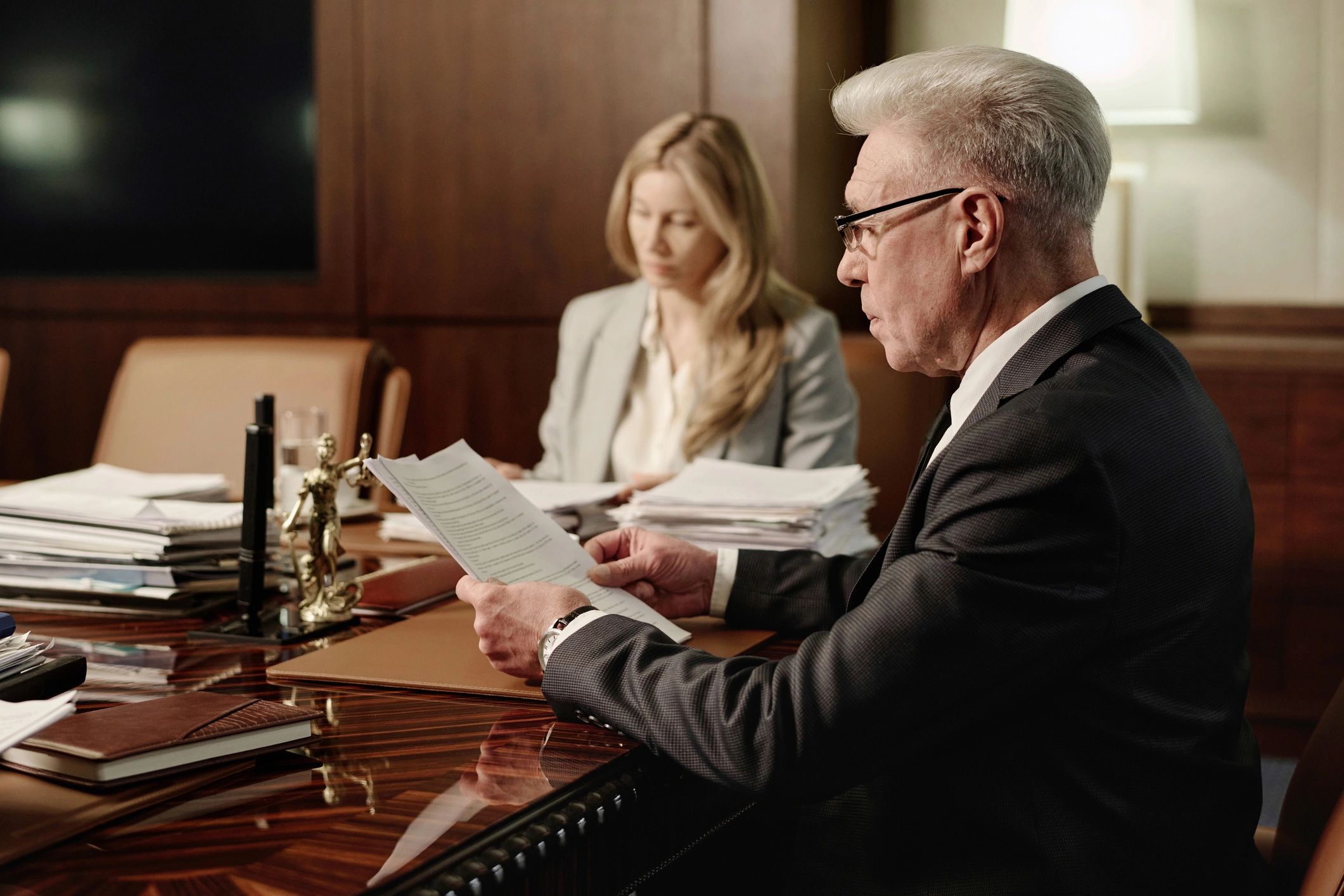 Office professionals reviewing paperwork