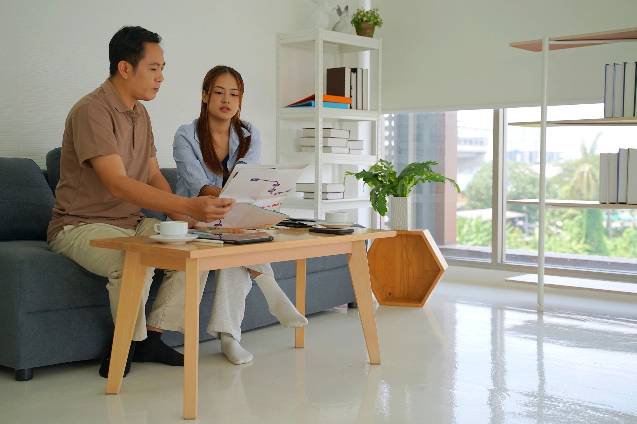 Couple planning together in a living room